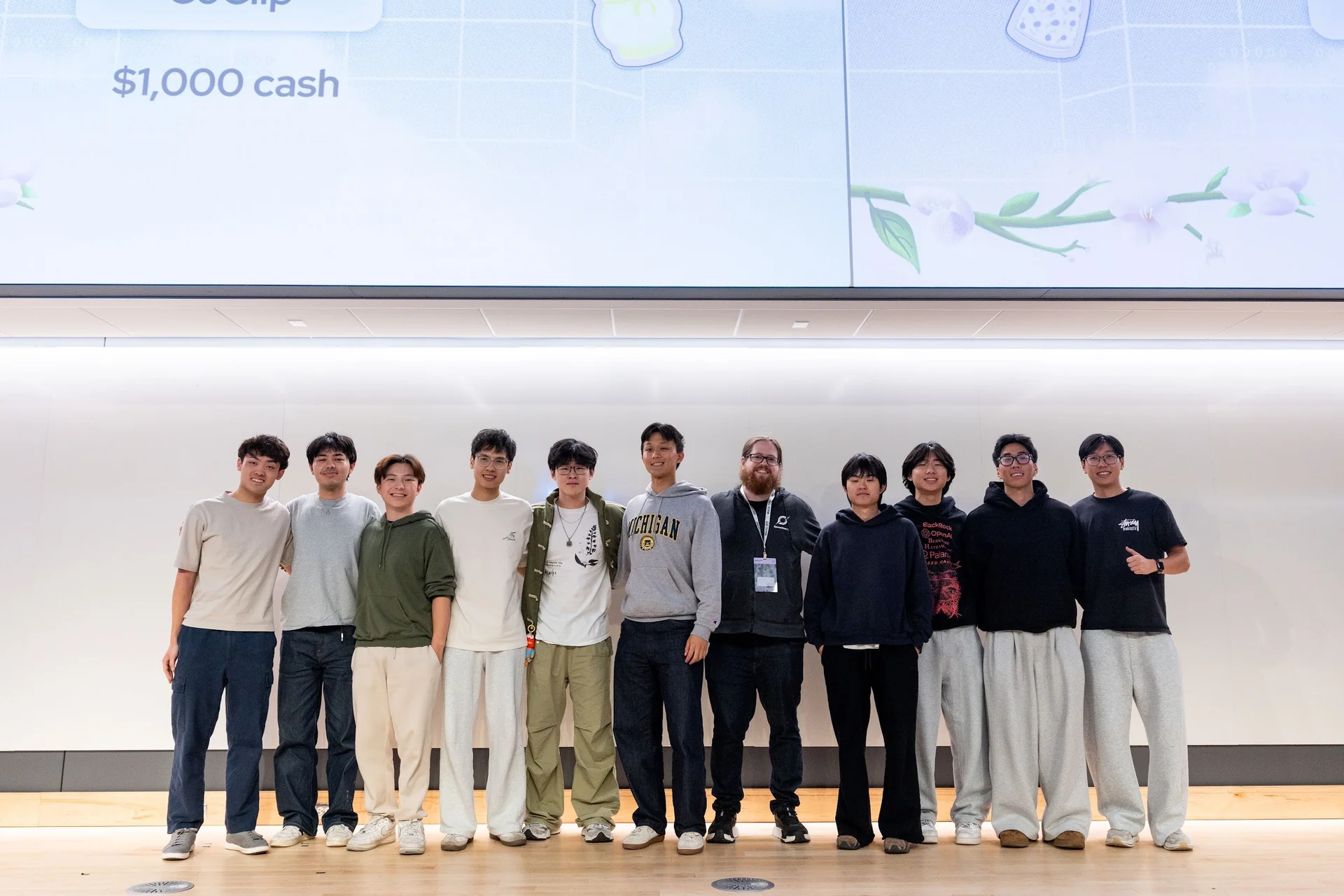 John onstage with members of Traycer, scalpal., and Yaapi at the MHacks closing ceremony.